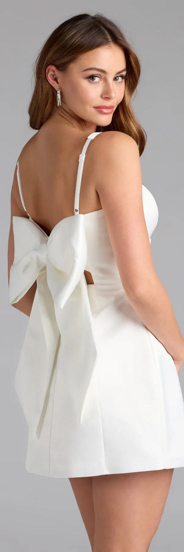 Own the evening in the Amalia Bow A-Line Satin Short Dress in white, a sultry cocktail dress perfect for rooftop parties and stylish soirées.