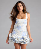 Shine with confidence, elegance, and standout style in the Fae Floral Ruffled Mini Dress—a blue graduation dress designed with a fresh silhouette and the latest trends.