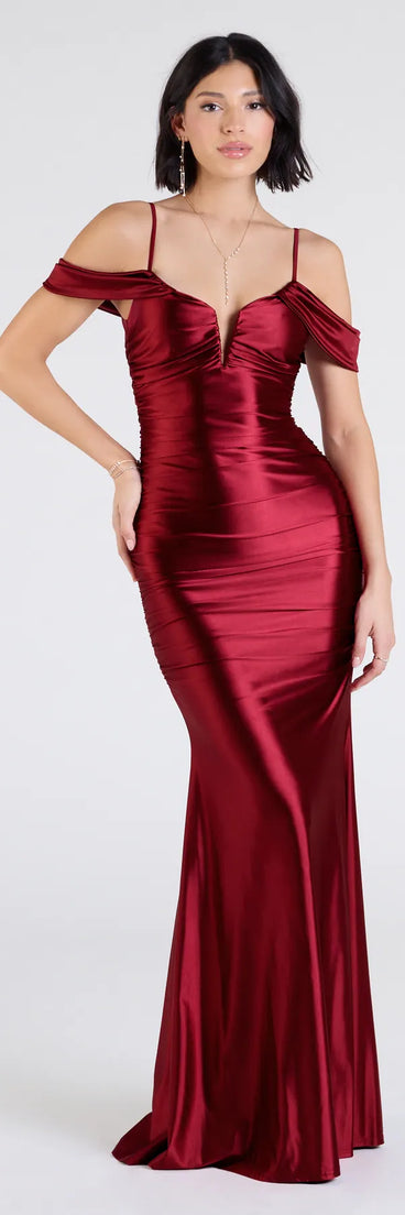 Own the spotlight in the Jelene Cold-Shoulder Mermaid Satin Formal Dress, a burgundy formal dress crafted to deliver luxe style for autumn weddings, Military Balls, or any special event.