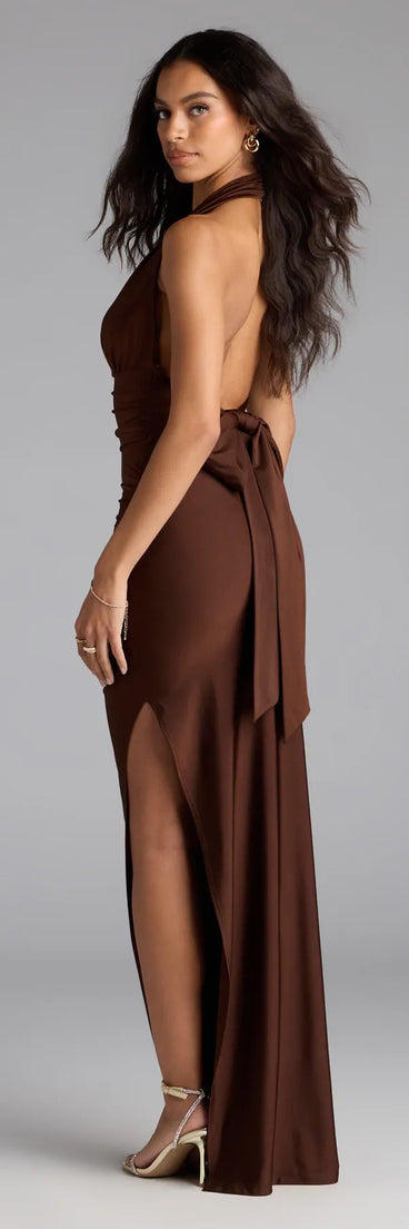 Own the spotlight in the Darla Halter Open Back Bow Slit Formal Dress, a brown formal dress crafted to deliver luxe style for autumn weddings, Military Balls, or any special event.