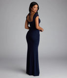 Own the spotlight in the Blossom Formal Halter Mermaid Dress, a navy blue formal dress crafted to deliver luxe style for summer weddings, Army Balls, or any special event.