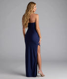 Own the spotlight in the Anisley Strapless High Slit Column Formal Dress, a navy blue formal dress crafted to deliver luxe style for summer weddings, Army Balls, or any special event.