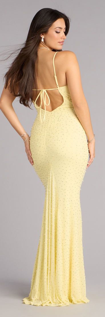 The Anisa Pearl Rhinestone Mermaid Formal Dress is a yellow prom dress that blends trend-forward design with a flattering fit, perfect for celebrating your night with confidence.