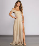 Turn heads at Prom 2025 in this gold prom dress, where statement-making details meet the iconic style of the Kaliyah Formal High Slit Lurex Dress .