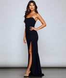 Turn heads at Prom 2025 in this navy blue prom dress, where statement-making details meet the iconic style of the Kaia Strapless High Slit Formal Dress.