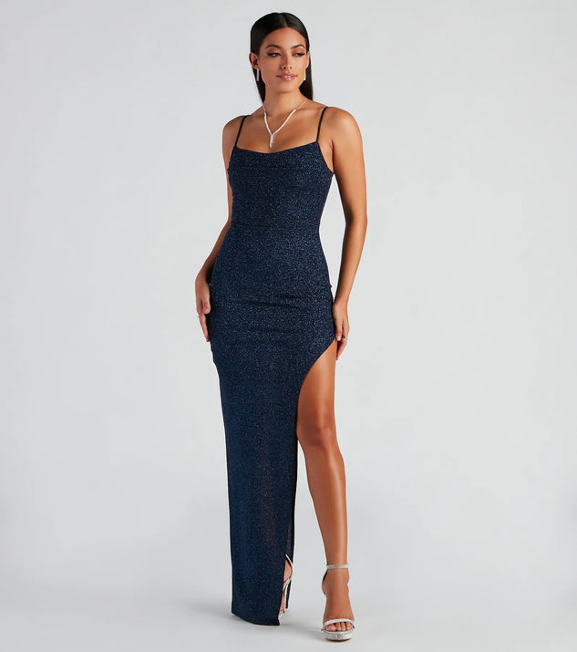 Turn heads at Prom 2025 in this navy blue prom dress, where statement-making details meet the iconic style of the Lola Formal High Slit Glitzy Glitter Dress .