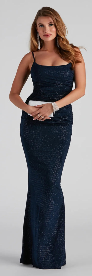 Turn heads at Prom 2025 in this navy blue prom dress, where statement-making details meet the iconic style of the Tatum Formal Glitter Mermaid Dress .