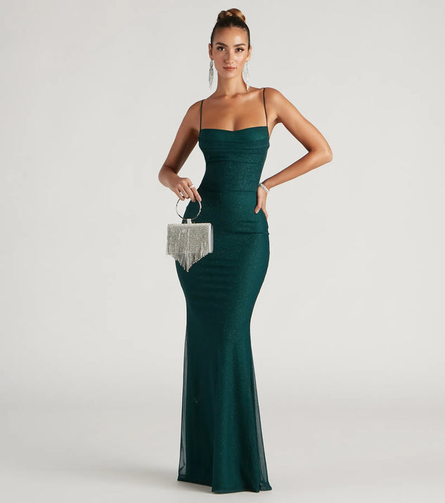 Turn heads at Prom 2025 in this teal prom dress, where statement-making details meet the iconic style of the Addison Glitter Mesh Formal Dress .