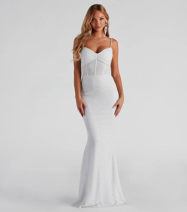 Turn heads at Prom 2025 in this white prom dress, where statement-making details meet the iconic style of the Kelsie Formal Glitter Mermaid Dress .