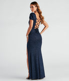 The Sophie Glitter Knit Mermaid Dress is an elegant navy blue formal dress in a rich seasonal color and with unique design accents that make dressing up for graduation photoshoots, military balls, or Prom 2025 effortless!