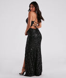 The Lori Formal Sequin Lace-Up Long Dress is a show-stopping black prom dress, offering a sleek, slimming silhouette that enhances your natural beauty for an unforgettable night.