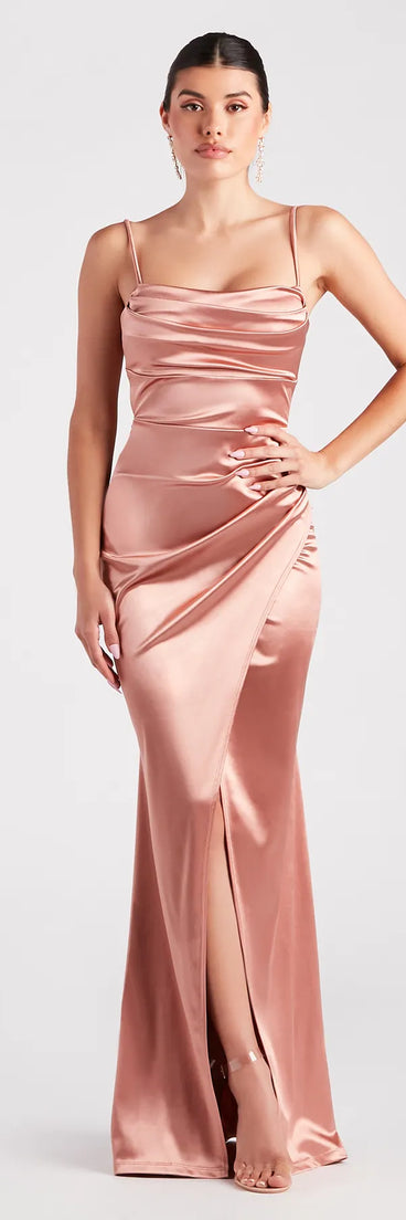 Turn heads at Prom 2025 in this rose gold prom dress, where statement-making details meet the iconic style of the Laurel Formal Satin Tie-Back Mermaid Dress .