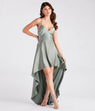 You'll look stunning in the Jolie Ruffled High-Low Satin Formal Dress, a sage green formal dress designed to create an effortless yet standout look as women's formal holiday attire, work party outfit, or NYE dress.