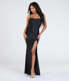 The Delia Formal Cowl Neck Long Dress is a show-stopping black prom dress, offering a sleek, slimming silhouette that enhances your natural beauty for an unforgettable night.