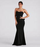 Turn heads at Prom 2025 in this black prom dress, where statement-making details meet the iconic style of the Breanne Strapless Ruffled Back Mermaid Dress .