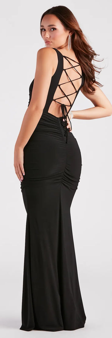 The Evania Formal Lace-Up Mermaid Dress is an elegant black formal dress in a rich seasonal color and with unique design accents that make dressing up for winter parties, holiday balls, or festive gatherings effortless!