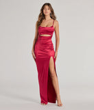 Turn heads at Prom 2025 in this burgundy prom dress, where statement-making details meet the iconic style of the Kyla Cutout High Slit Satin Formal Dress .