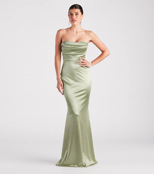 Turn heads at Prom 2025 in this sage green prom dress, where statement-making details meet the iconic style of the Priscilla Formal Satin Strapless Mermaid Dress .