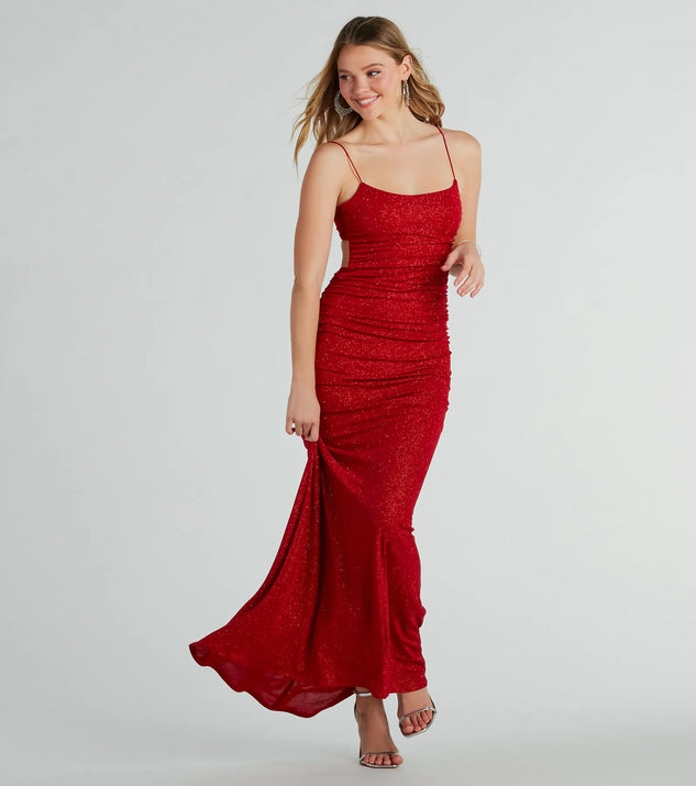 Turn heads at Prom 2025 in this red prom dress, where statement-making details meet the iconic style of the Britnee Formal Glitter Open Back Long Dress .