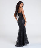 The Anna Bustier Mermaid Glitter Sequin Formal Dress is a show-stopping black prom dress, offering a sleek, slimming silhouette that enhances your natural beauty for an unforgettable night.
