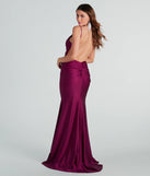 The Reagan Formal Satin Low Back Mermaid Dress is an elegant plum formal dress in a rich seasonal color and with unique design accents that make dressing up for winter parties, holiday balls, or festive gatherings effortless!