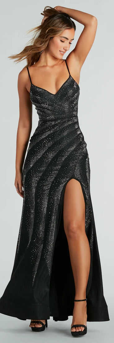 The stunning Tessa Formal Rhinestone Mermaid Slit Long Dress provides a chic silhouette and party-ready details that make it a standout black dress for cocktail events, New Year's Eve parties, or as a winter wedding guest look.