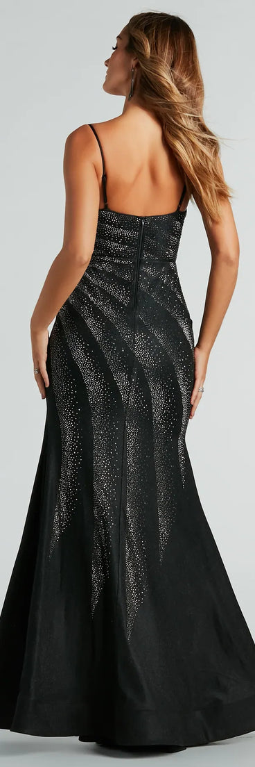 The stunning Tessa Formal Rhinestone Mermaid Slit Long Dress provides a chic silhouette and party-ready details that make it a standout black dress for cocktail events, New Year's Eve parties, or as a winter wedding guest look.