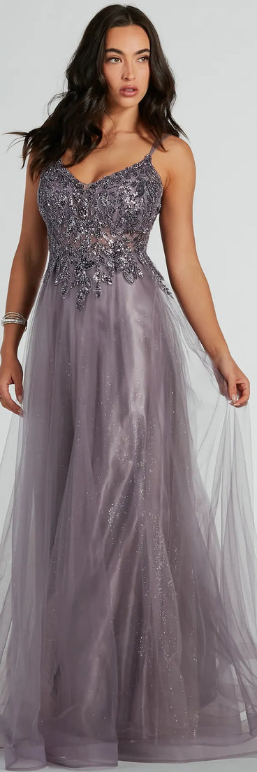 Turn heads in the beaming Vanessa A-Line Glitter Tulle Formal Dress, a stunning lavender sequin dress designed to add sparkle and elegance to your next night out or special occasion.