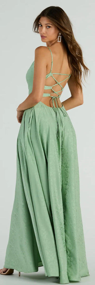 Own the spotlight in the Silvia Lace-Up Floral Satin A-Line Formal Dress, a sage green formal dress crafted to deliver luxe style for summer weddings, Army Balls, or any special event.