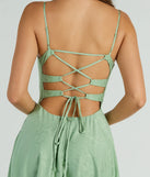 Step into summer looking effortlessly chic in the Silvia Lace-Up Floral Satin A-Line Formal Dress in sage green, a must-have Windsor dress for your warm-weather wardrobe.