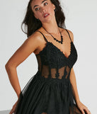 The Fatima V-Neck Embroidered A-Line Tulle Dress in luxe black fabric, a stunning prom dress with statement details designed to make a bold impression at Prom 2025.