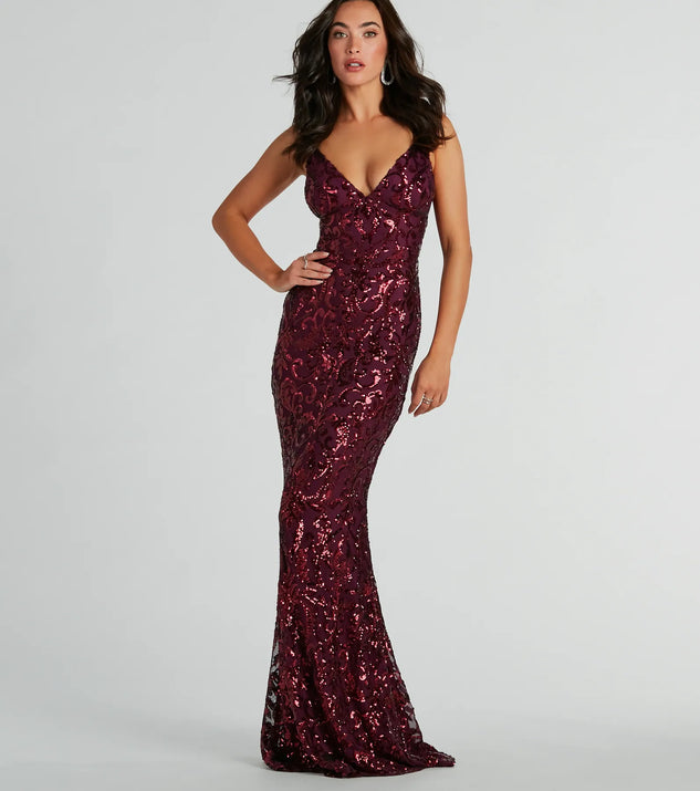 Turn heads at Prom 2025 in this plum prom dress, where statement-making details meet the iconic style of the Bethanie Formal Sequin V-Neck Mermaid Dress .