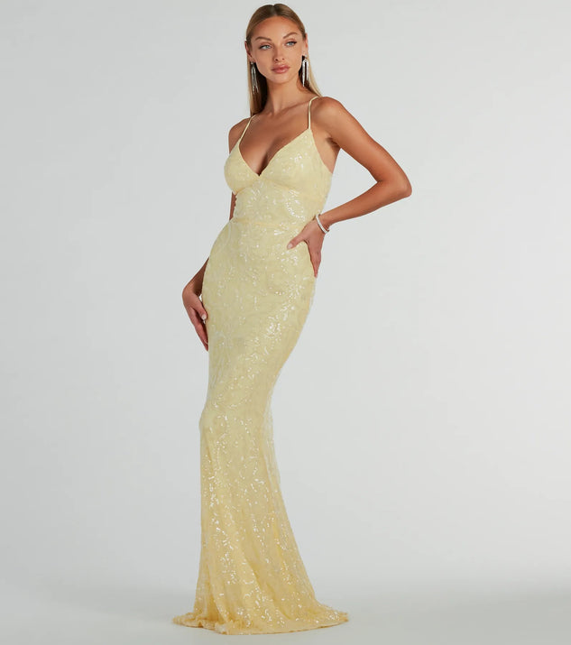 Turn heads at Prom 2025 in this yellow prom dress, where statement-making details meet the iconic style of the Bethanie Formal Sequin V-Neck Mermaid Dress .