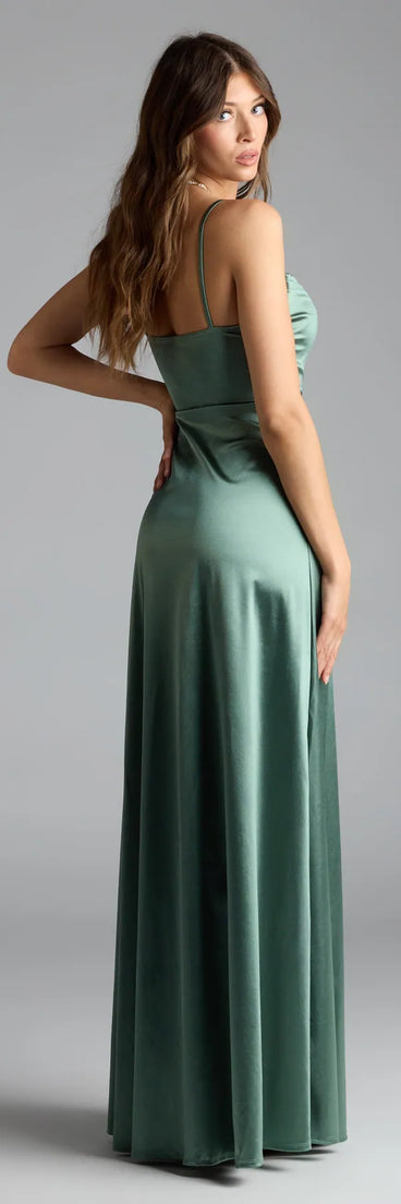 Own the spotlight in the Marissa Formal Satin Cowl Neck Dress, a sage green formal dress crafted to deliver luxe style for fall weddings, military balls, or any special event.