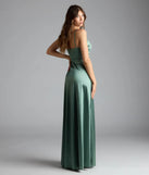 Own the spotlight in the Marissa Formal Satin Cowl Neck Dress, a sage green formal dress crafted to deliver luxe style for summer weddings, Army Balls, or any special event.