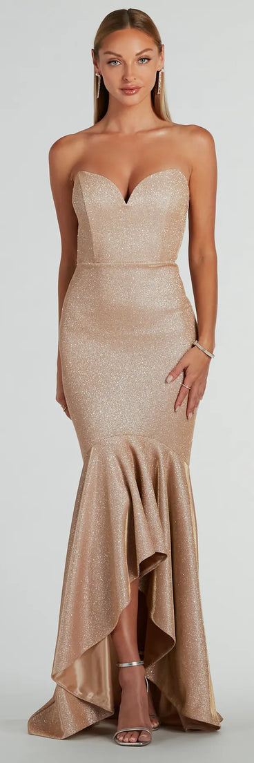 The Kimora Strapless High Low Mermaid Formal Dress is a shimmery gold glitter dress that catches the light beautifully, perfect for any special outfit like Winter Formal attire, clubwear, or a wedding guest dress.
