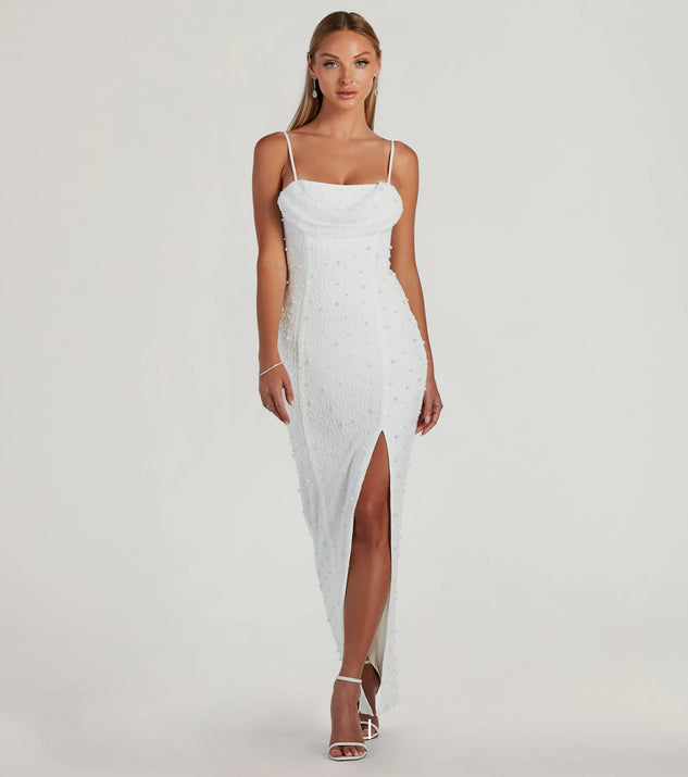 Turn heads at Prom 2025 in this white prom dress, where statement-making details meet the iconic style of the Klara Cowl Neck Faux Pearl Bead Slim Formal Dress .