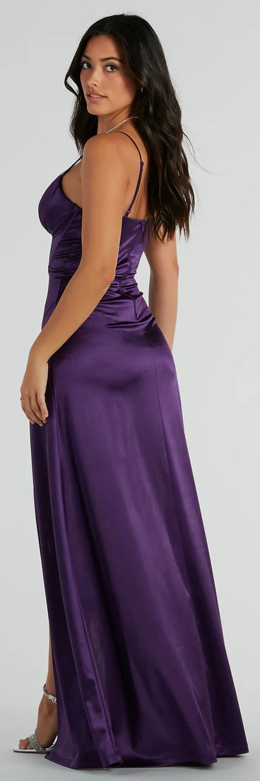 The Haley Corset Slit A-Line Satin Formal Dress is an elegant purple formal dress in a rich seasonal color and with unique design accents that make dressing up for winter parties, holiday balls, or festive gatherings effortless!