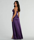 The Haley Corset Slit A-Line Satin Formal Dress is an elegant purple formal dress in a rich seasonal color and with unique design accents that make dressing up for winter parties, holiday balls, or festive gatherings effortless!