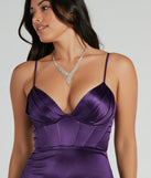 The Haley Corset Slit A-Line Satin Formal Dress is an elegant purple formal dress in a rich seasonal color and with unique design accents that make dressing up for winter parties, holiday balls, or festive gatherings effortless!