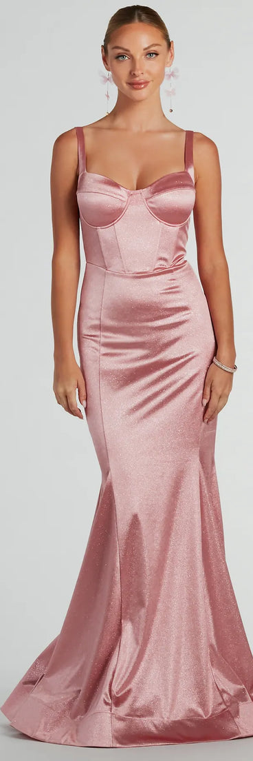 The Ria Bustier Mermaid Glitter Satin Formal Dress is a shimmery blush glitter dress that catches the light beautifully, perfect for any special outfit like Winter Formal attire, clubwear, or a wedding guest dress.