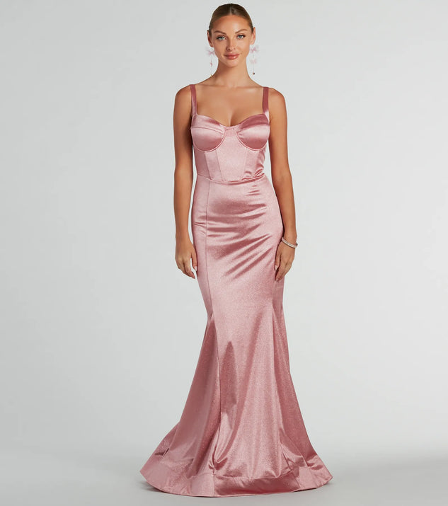 The Ria Bustier Mermaid Glitter Satin Formal Dress is a shimmery blush glitter dress that catches the light beautifully, perfect for any special outfit like Winter Formal attire, clubwear, or a wedding guest dress.