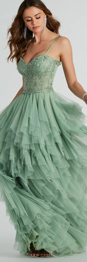 Turn heads at Prom 2025 in this sage green prom dress, where statement-making details meet the iconic style of the Keyla Floral Applique Tiered Ruffle Tulle Gown .