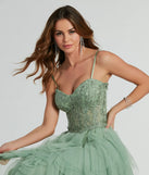 Make a bold statement in the Keyla Floral Applique Tiered Ruffle Tulle Gown in sage green, the perfect green dress for weddings, cocktail hours, nights out, and/or seasonal celebrations.
