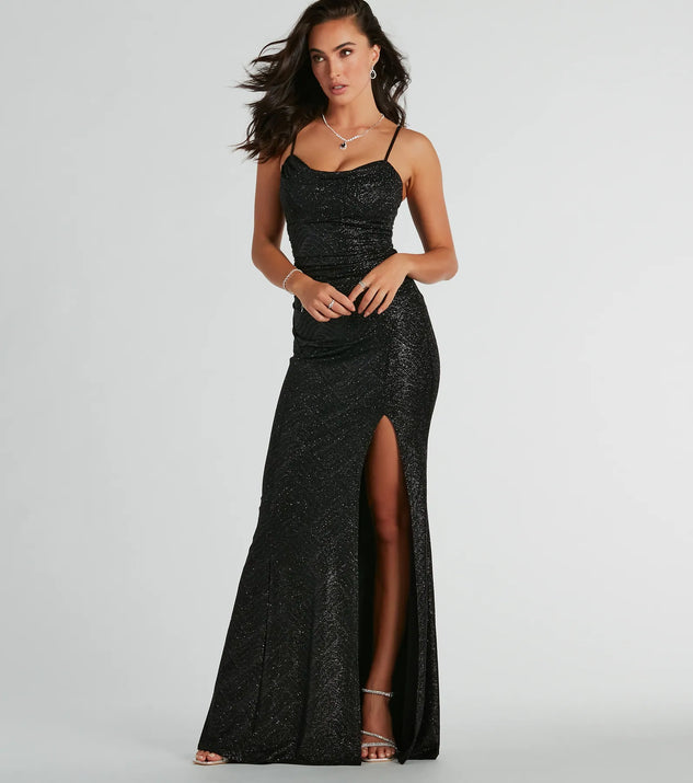 Turn heads at Prom 2025 in this black prom dress, where statement-making details meet the iconic style of the Ashelyn Cowl Neck Glitter Mermaid Formal Dress .