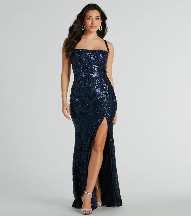 Turn heads at Prom 2025 in this navy blue prom dress, where statement-making details meet the iconic style of the Moira Lace-Up Bodycon Sequin Formal Dress .