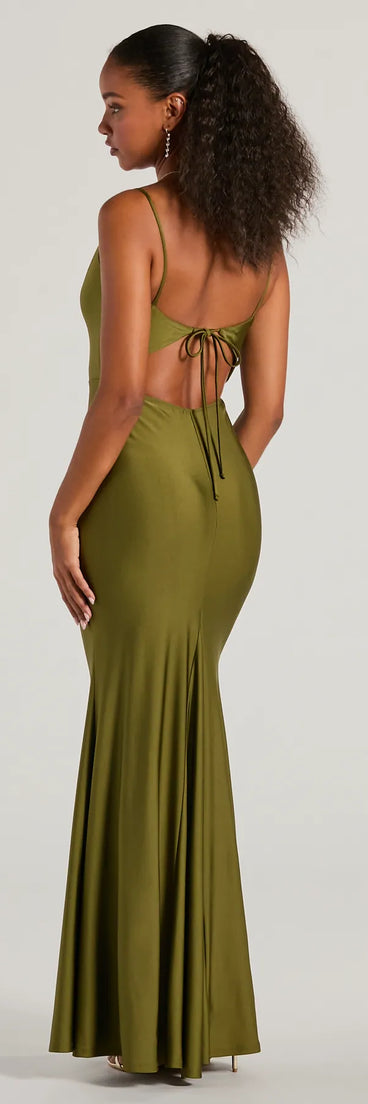 The Virginia Cowl Neck Tie-Back Mermaid Formal Dress in olive is a stunning green prom dress designed to capture attention with its fresh or bold color and effortlessly stylish silhouette.