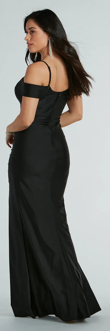 The Danielle Cold-Shoulder Ruched Knit Formal Dress is a show-stopping black prom dress, offering a sleek, slimming silhouette that enhances your natural beauty for an unforgettable night.