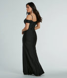 The Danielle Cold-Shoulder Ruched Knit Formal Dress is a show-stopping black prom dress, offering a sleek, slimming silhouette that enhances your natural beauty for an unforgettable night.