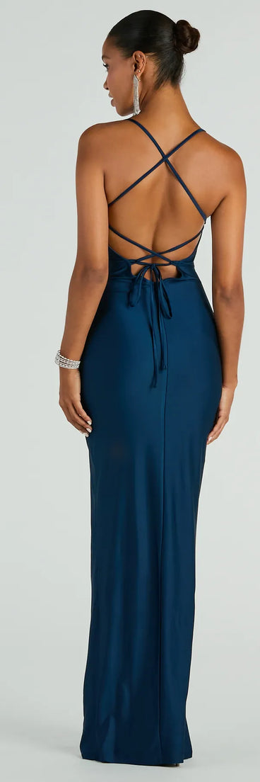 A stunning pick for an engagement photoshoot outfit or autumn wedding guest dress, this fall formal dress showcases the Natalie Cowl Neck Lace-Up Slit Column Dress in navy blue with a graceful silhouette that captures the moment.